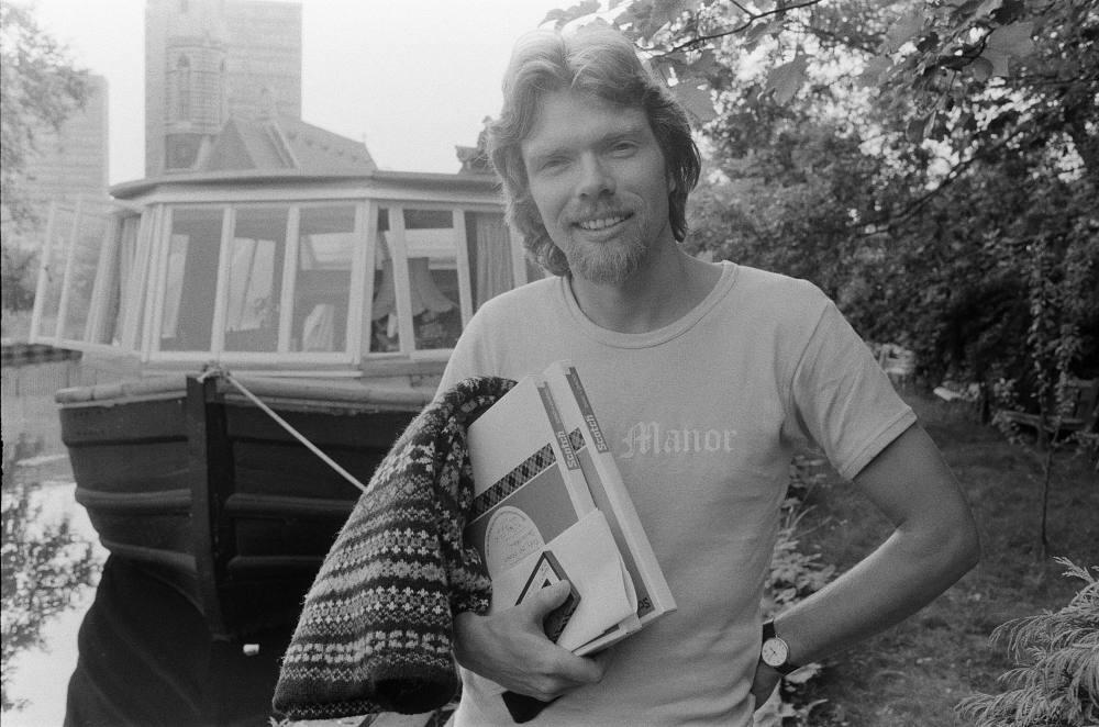 Richard Branson at age 28, in front of his houseboat