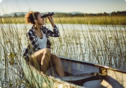 birdwatching on a canoe in a lake