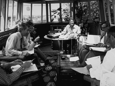 Richard Branson working with his team on a houseboat Richard Branson working with his team on a houseboat